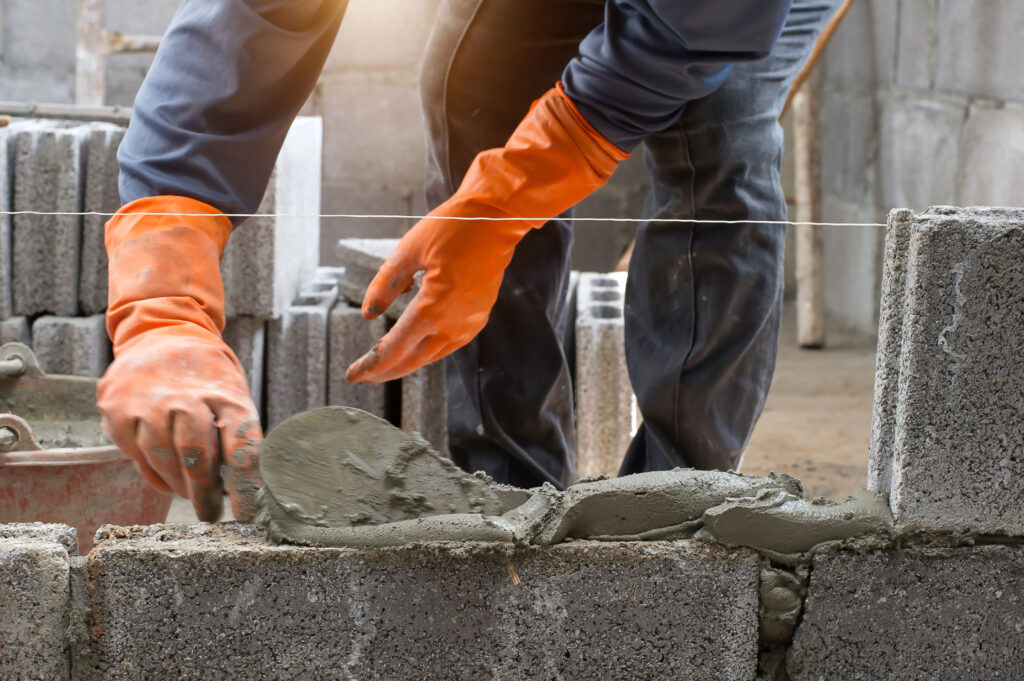 Masonry,Worker,Make,Concrete,Wall,By,Cement,Block,And,Plaster