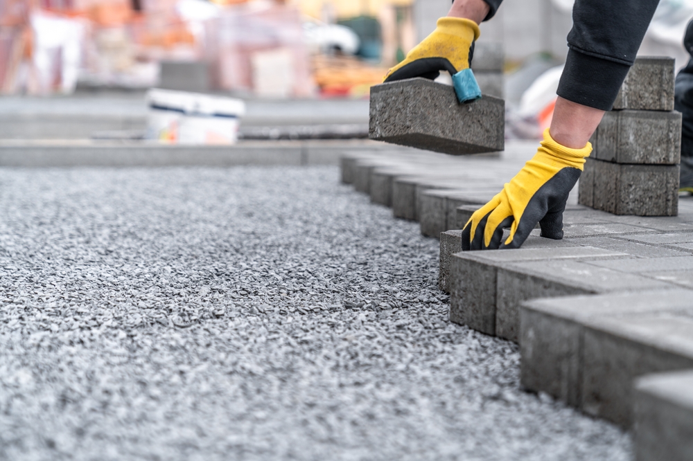 Laying,Interlocking,Pavers,During,The,Construction,Of,Sidewalks,And,Roads.