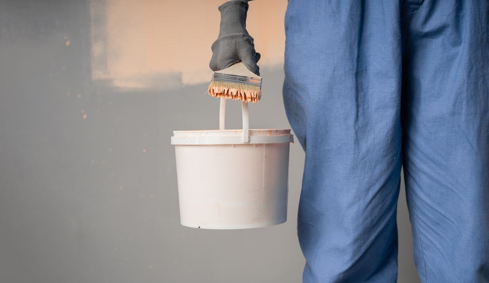 Close up,Of,A,Painter,With,A,Bucket,And,Brush,Standing