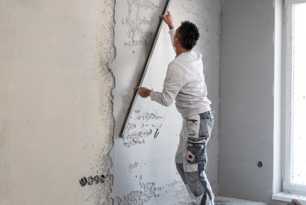 Machine,Plastering.,Applying,Gypsum,Plaster,By,Mechanized,Method,On,A