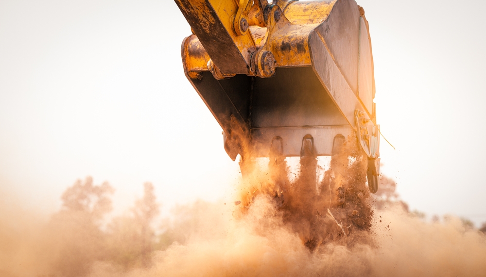 Backhoe,Working,By,Digging,Soil,At,Construction,Site,Bucket,Of