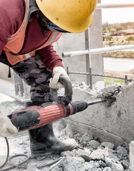 Road,Repairing,Works,With,Jackhammer,Concrete,At,Construction,Site