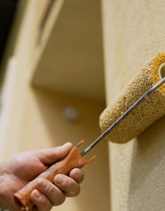 A,Maintenance,Worker,Uses,A,Roller,Brush,To,Paint,A