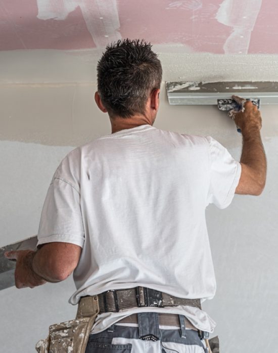 The,Worker,Make,A,Plasterboard,Ceiling.,He,Does,Taping,Plaster